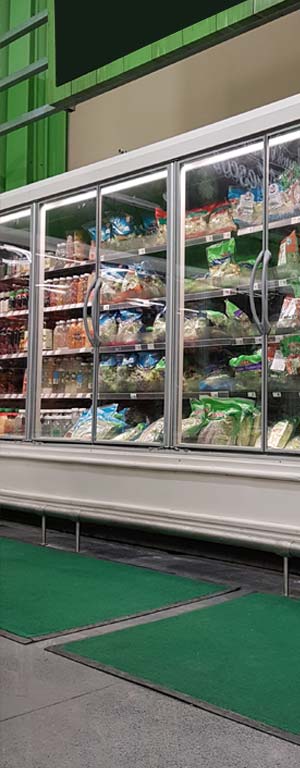 Tapete Retenedor verde para area de verduras congeladas en supermercado
